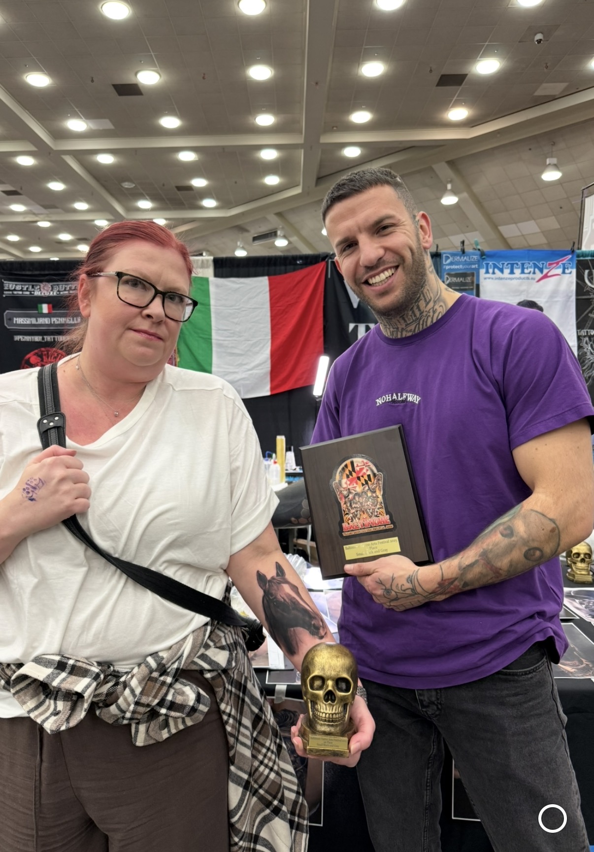 Federico Galliani with a first-place plaque at a U.S. tattoo convention